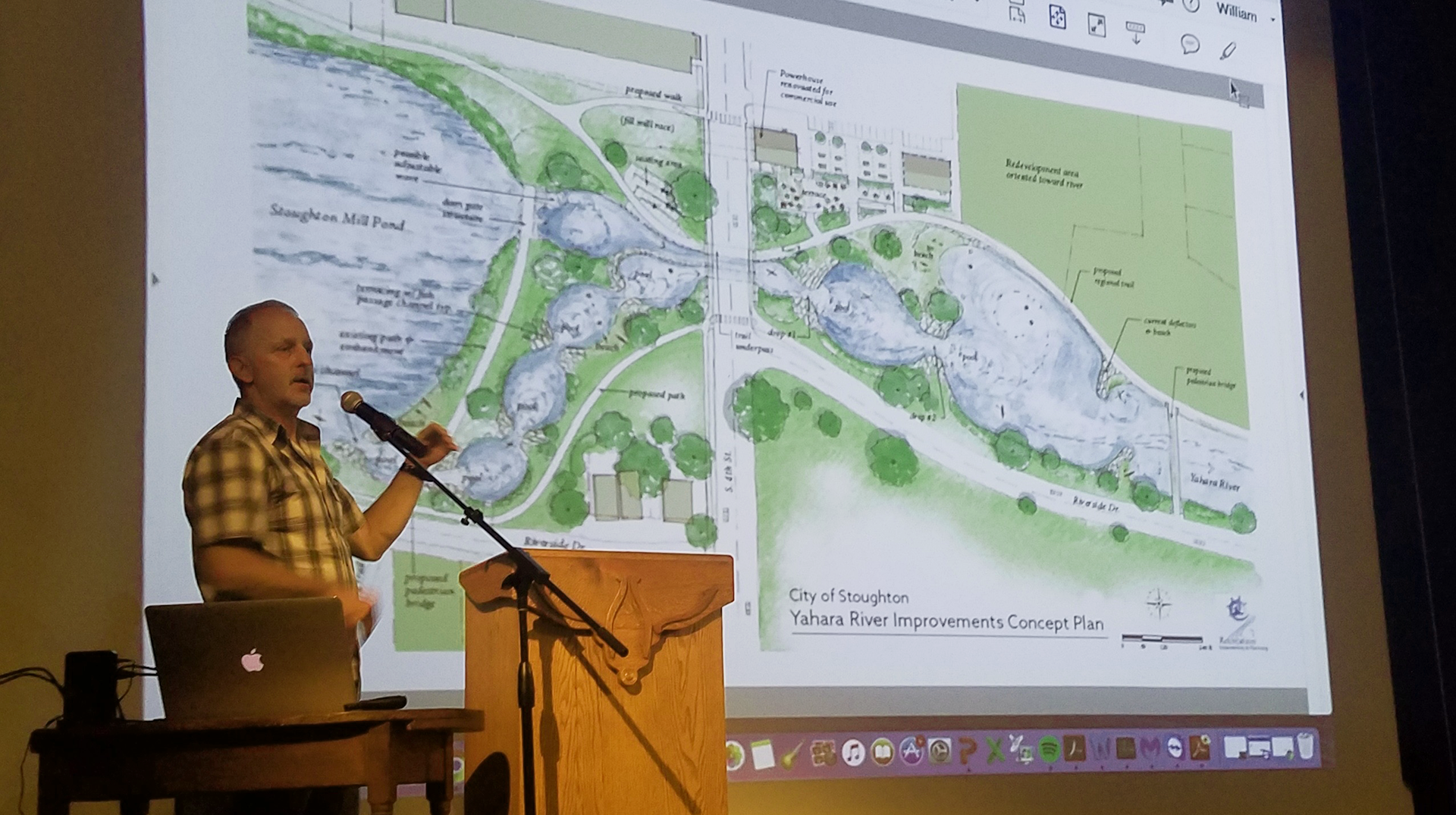 Gary Lacy giving a presentation during a community open house in downtown Stoughton about the proposed river recreation park around the Stoughton Dam on the Yahara River.